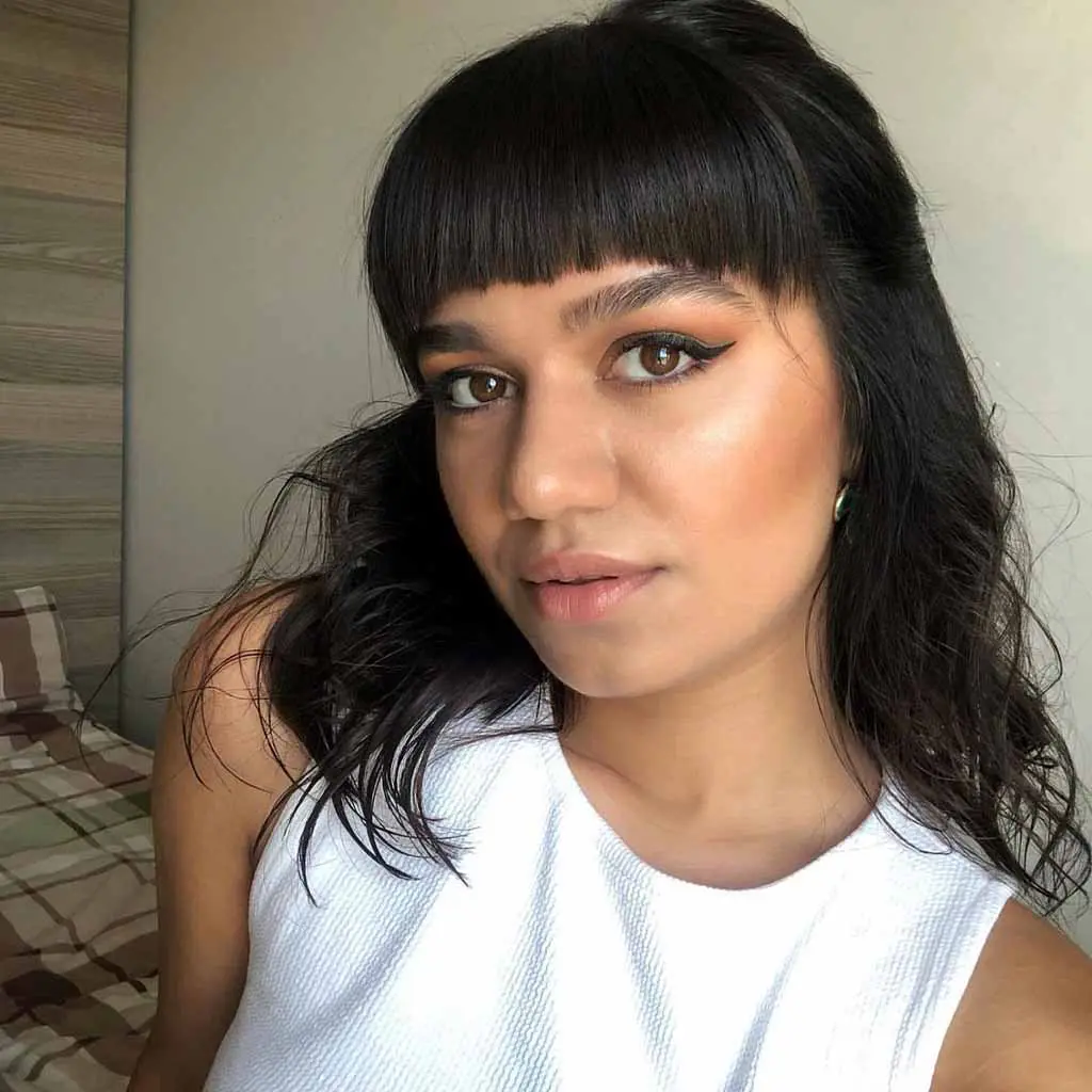 Black Medium Layered Hair With Blunt Bangs