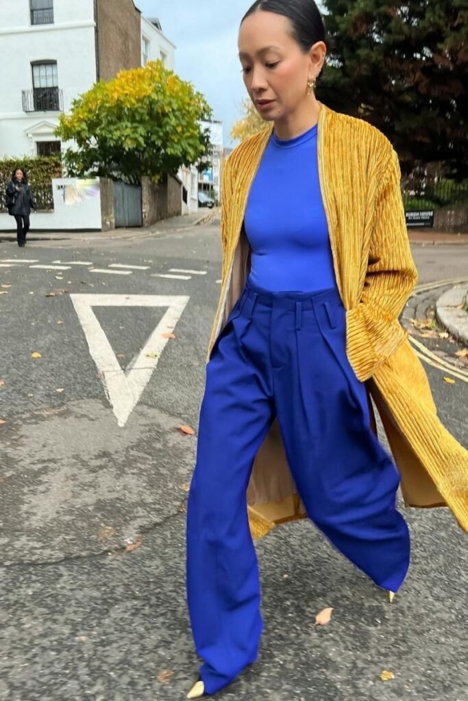 Dark blue pants with a vibrant yellow coat