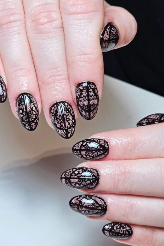 Intricate Lace Nude and Black Nail Design