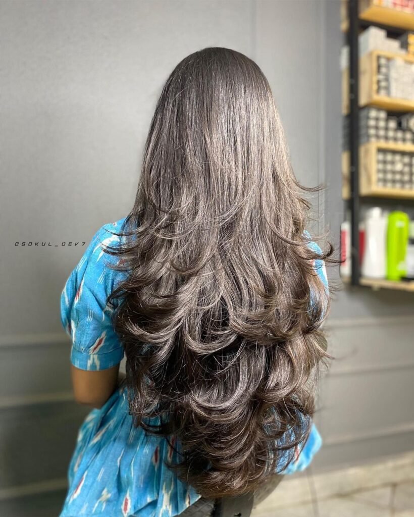 Long Feathered Layers For Round Face Shape