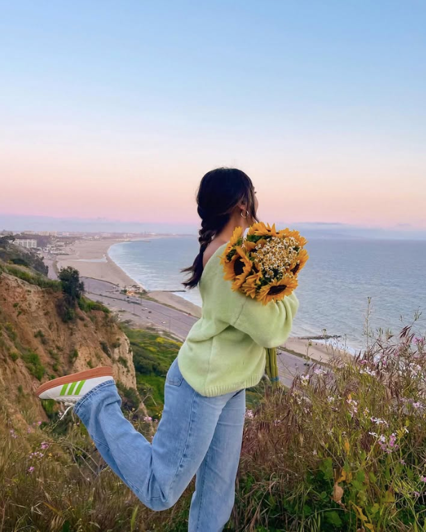 Mint green sweater and light blue jeans