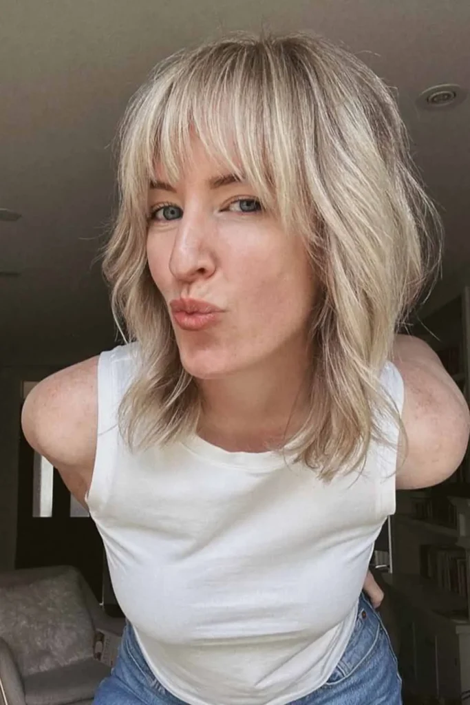 Textured Bob With Curtain Bangs Hairstyle