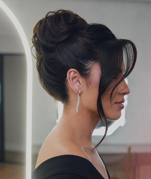 Textured High Bun with Face Framing Layers