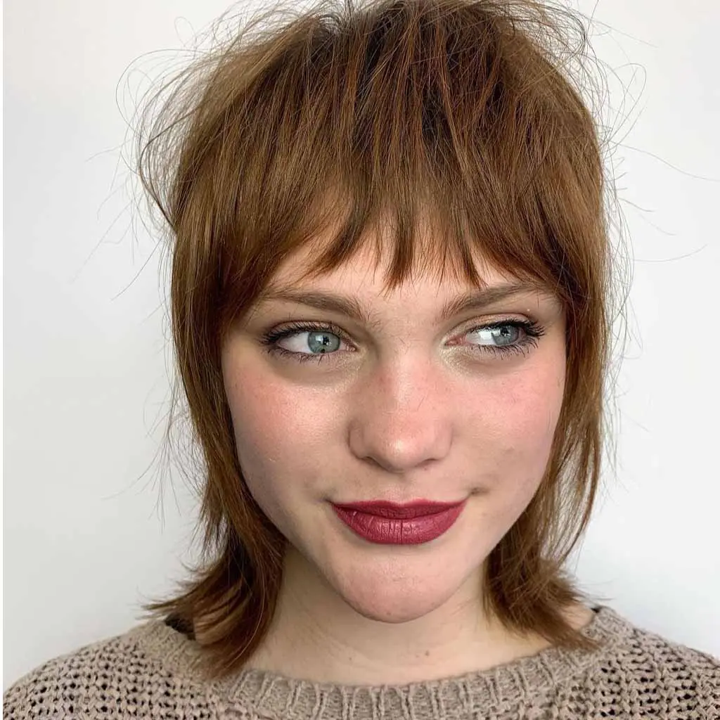 Textured Razor Shag Hair Cut With Asymmetric Bangs