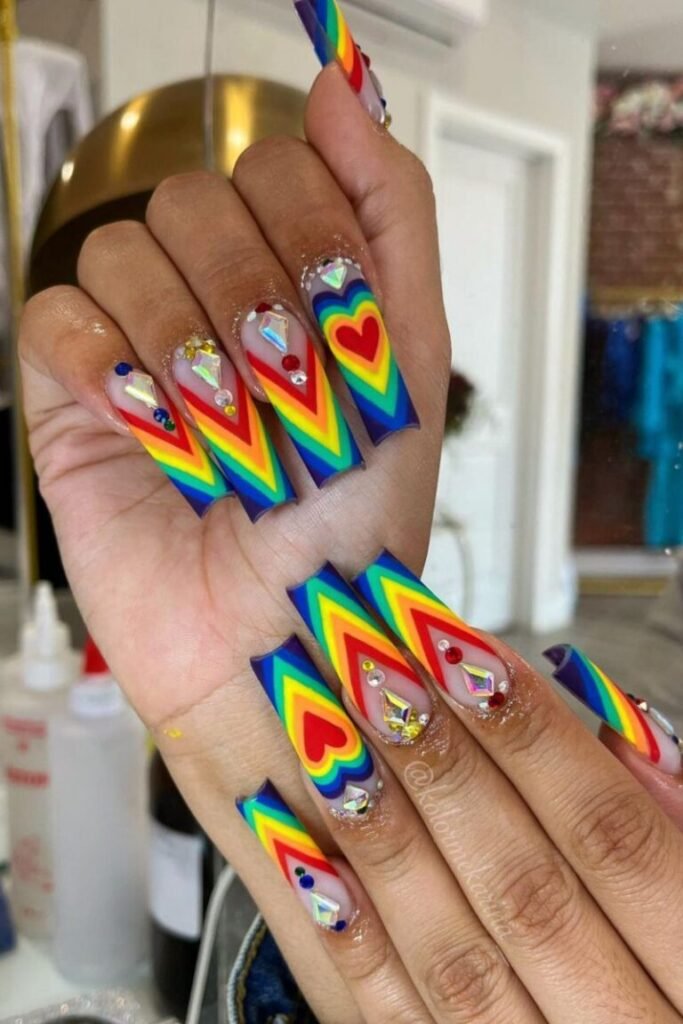 Vibrant Heart and Rainbow Nail Design