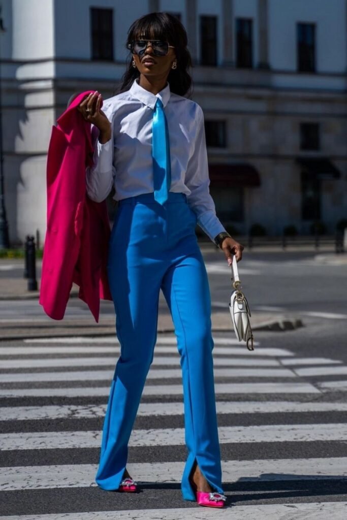blue pants with a crisp white button up shirt and a matching blue tie