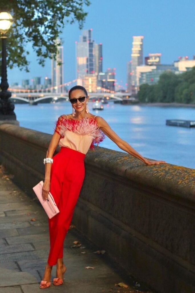 feathered pink top with red pants