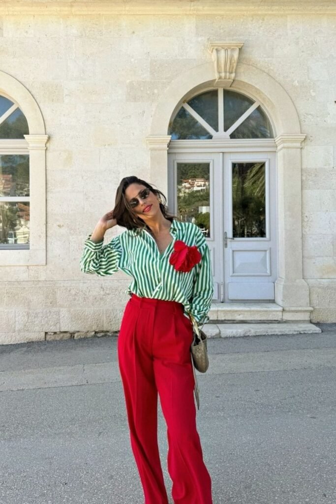 green and white striped shirt paired with red pants