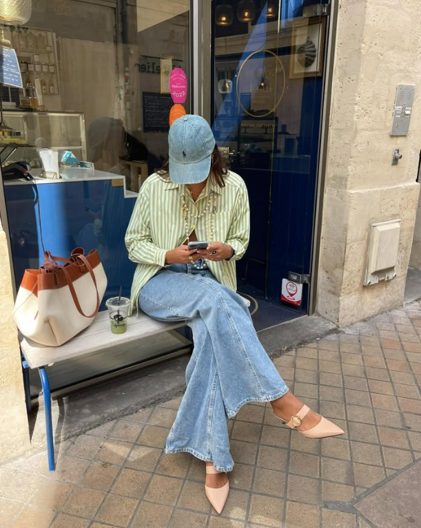 green striped shirt and wide leg denim jeans