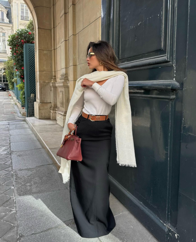 light full sleeves sweater and black maxi skirt