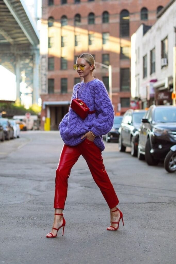 oversized lavender knit with red leather pants