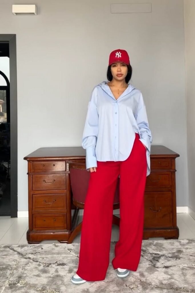 red pants with a light blue oversized shirt