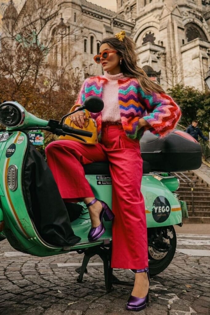 red pants with a rainbow chevron knit sweater