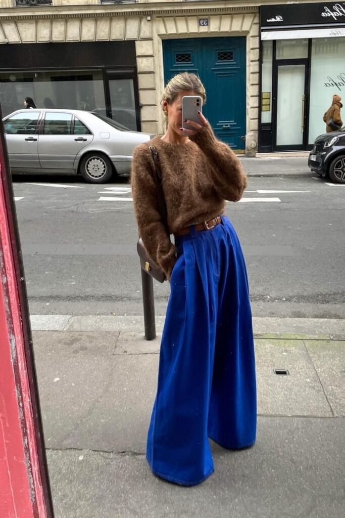 wide legged blue pants with a cozy brown sweater