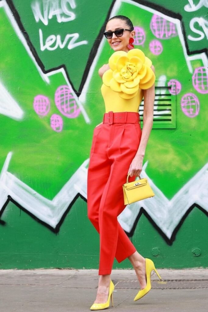 yellow floral top with red high waisted pants