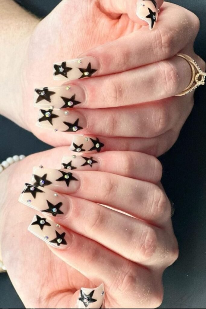 Black Star Nails with Rhinestone Accents