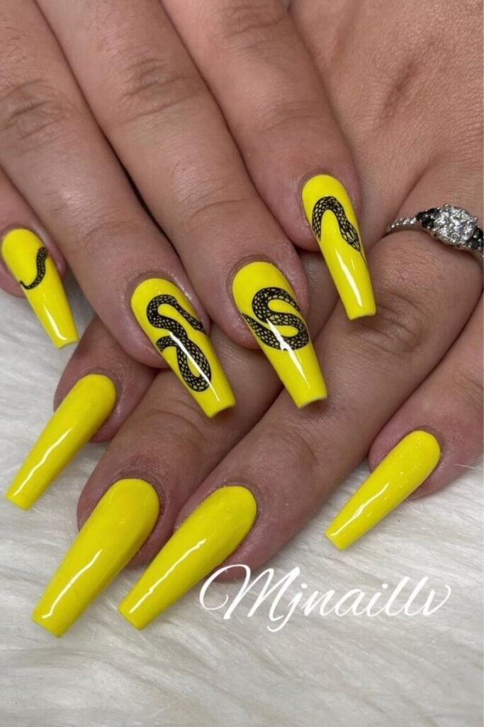 Bold Yellow Long Coffin Nails with Snake Accents