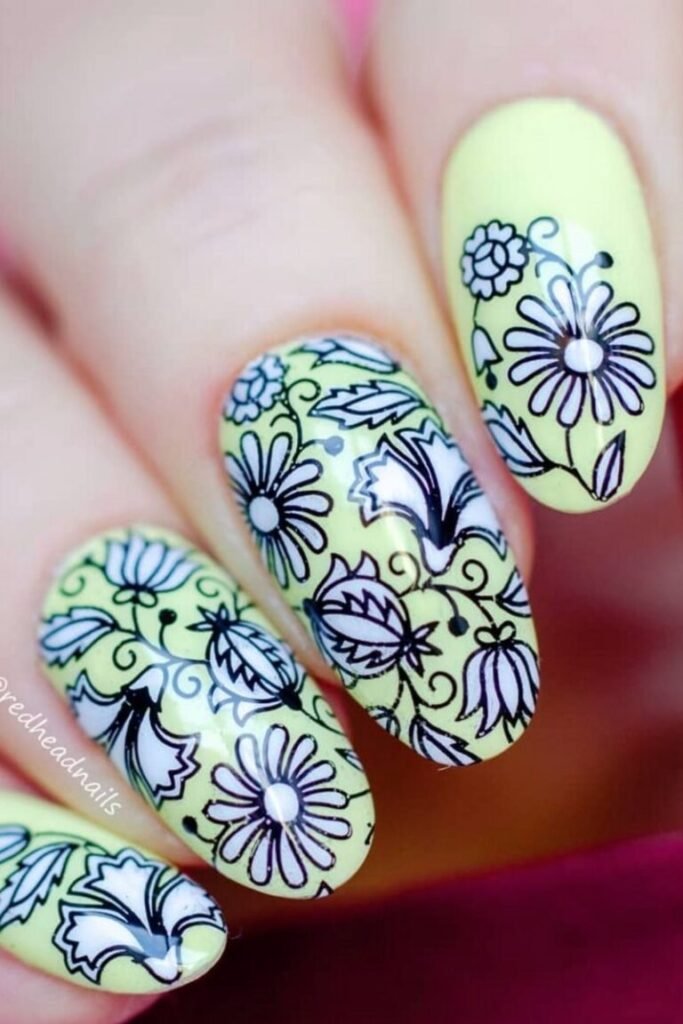 Floral Patterns on Pale Yellow Nails