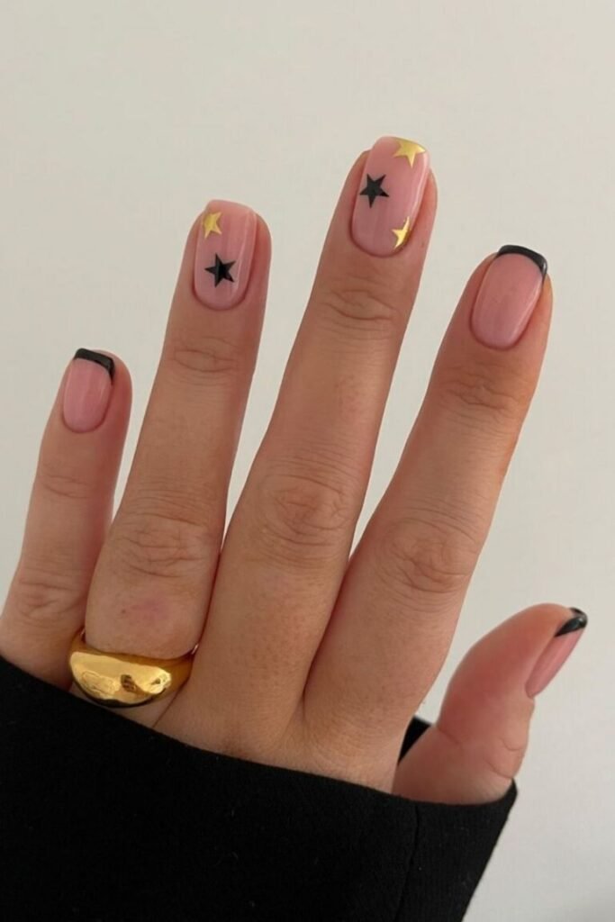 Golden and Black Star Accent Nails