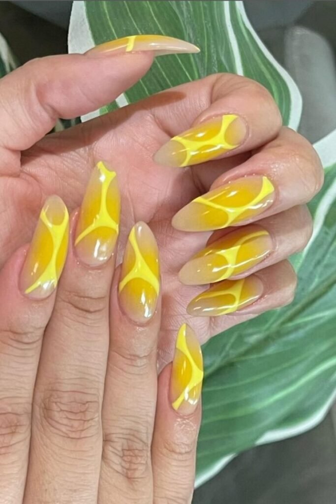 Translucent Yellow Swirls on Almond Nails
