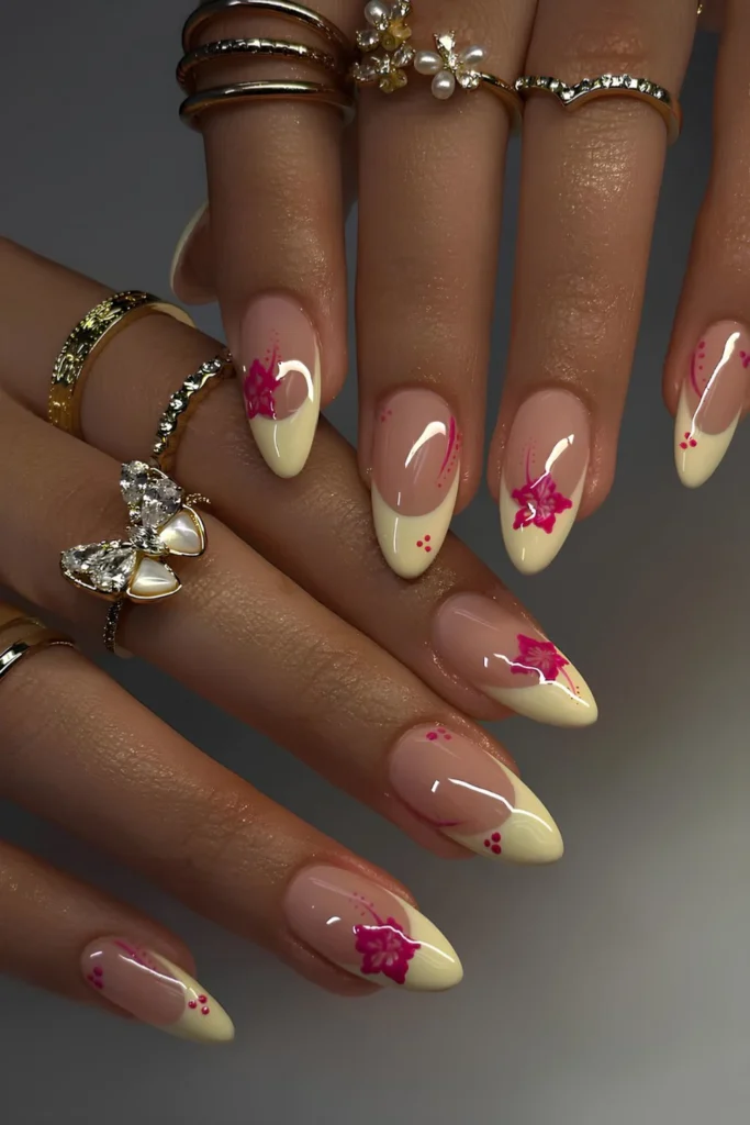Butter yellow French mani with pink hibiscus art.jpg