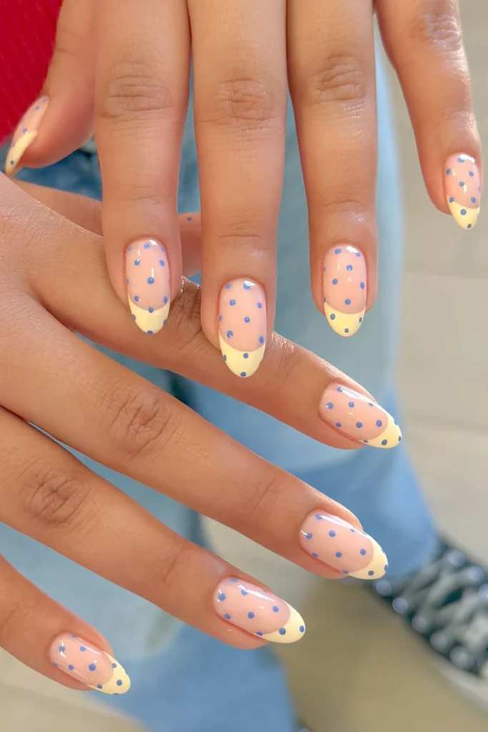 Butter yellow French nails with blue polka dots.jpg