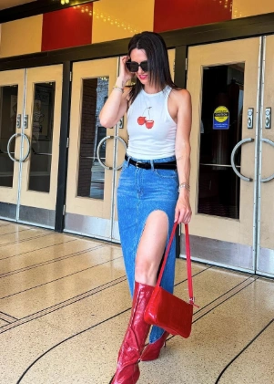 Chic Cherry Graphic Tank High Slit Denim Maxi Skirt Red Knee High Boots Red Crossbody Bag Black Belt