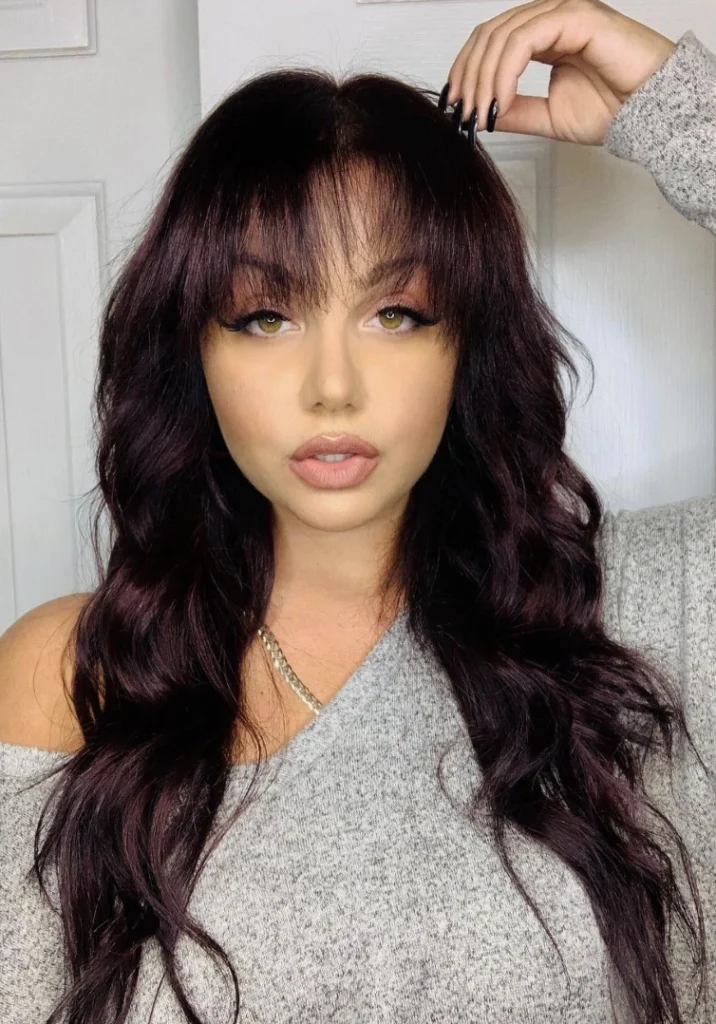 Long Wavy Hair with Textured Bangs in Deep Burgundy