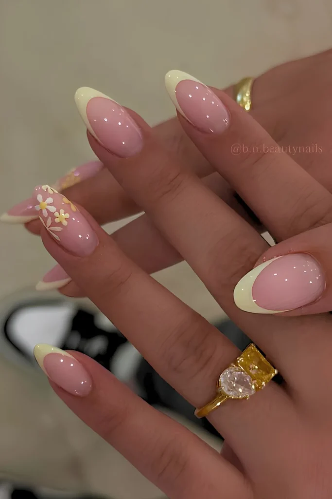 Pastel yellow French nails with florals.jpg