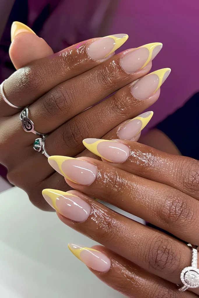 Swirly yellow French tip manicure.jpg