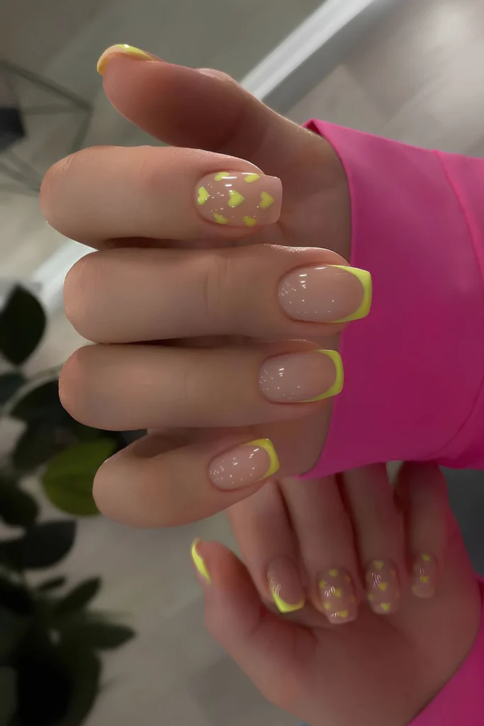 Yellow French manicure with hearts.jpg