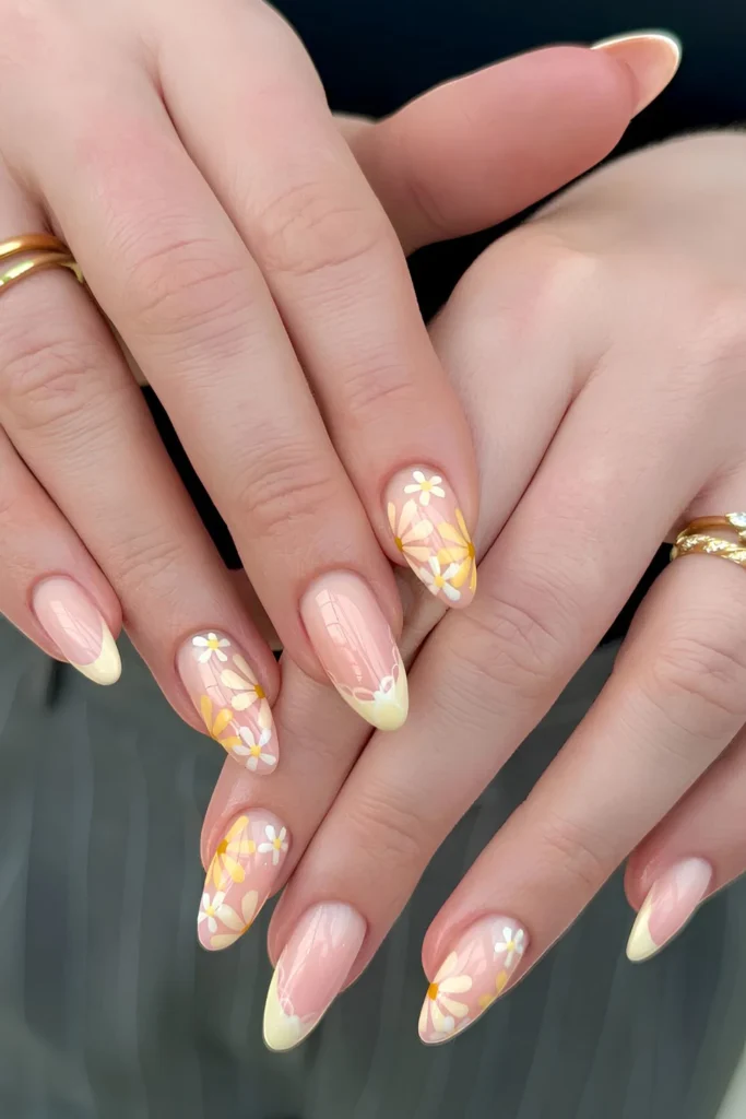 Yellow French nails with flowers and bows.jpg
