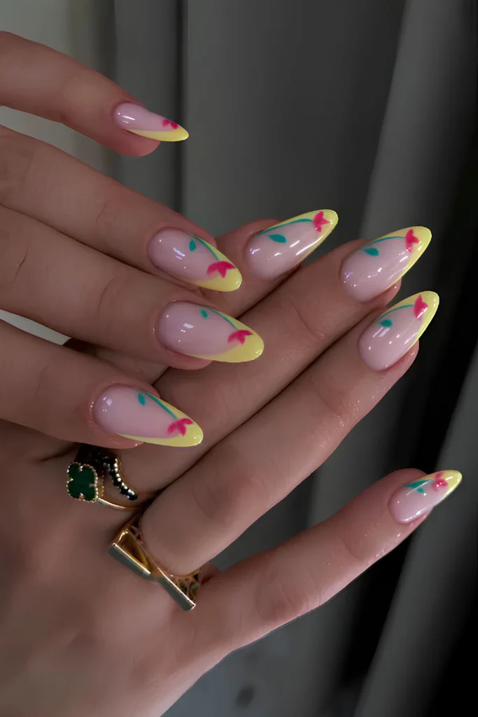 Yellow French nails with red tulip art.jpg