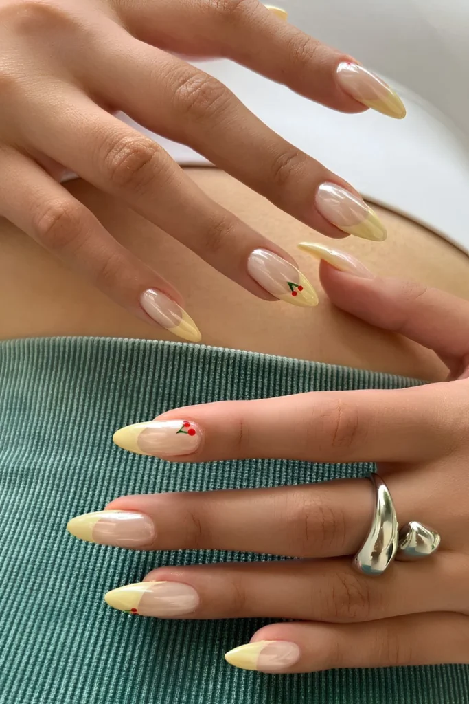 Yellow chrome French nails with cherries.jpg