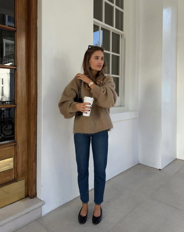 beige sweater blue jeans and black flats
