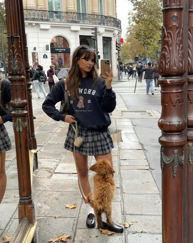 black sweatshirt and plaid skirt
