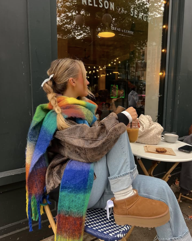 brown jacket light blue jeans and tan platform boots