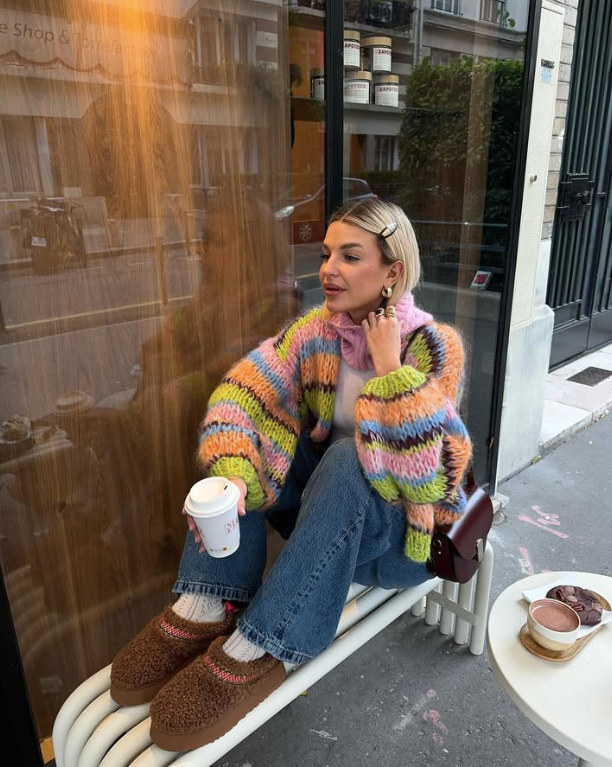 colorful chunky knit sweater and blue jeans