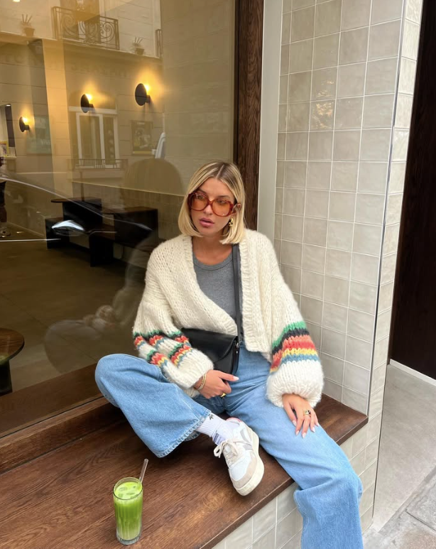 colorful knit cardigan and blue jeans