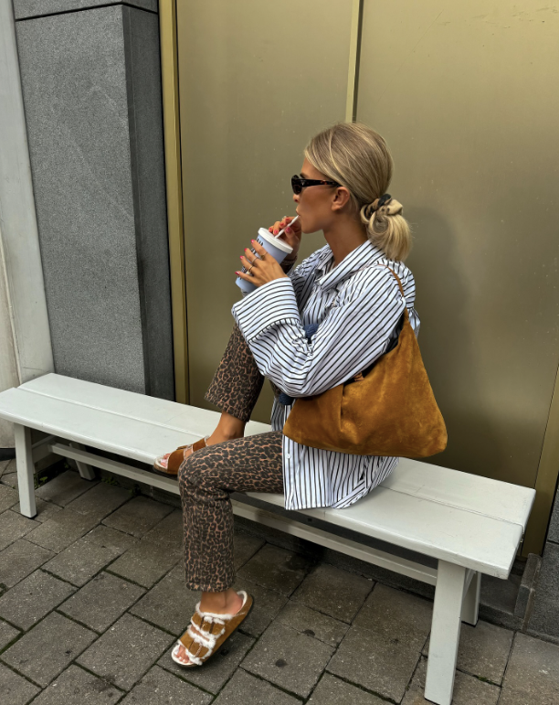 striped shirt leopard print pants and fuzzy sandals