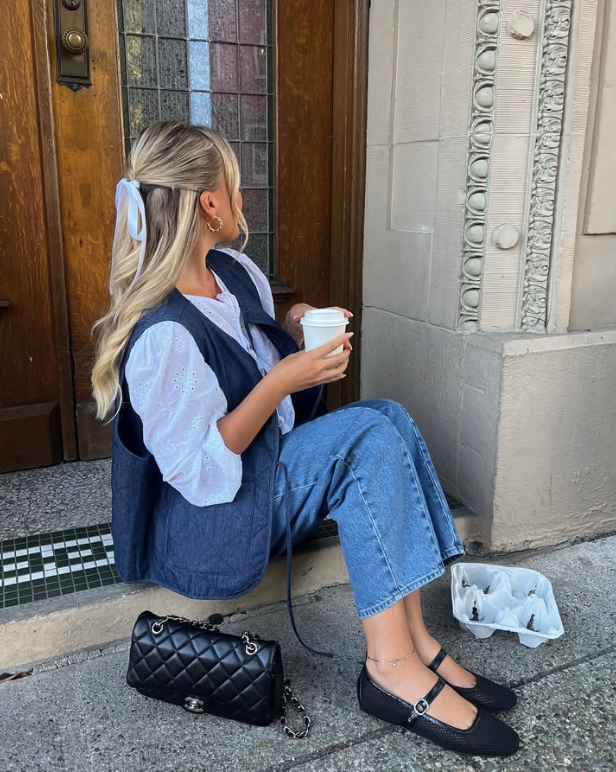 white blouse blue denim vest and jeans paired with black Mary Jane shoes