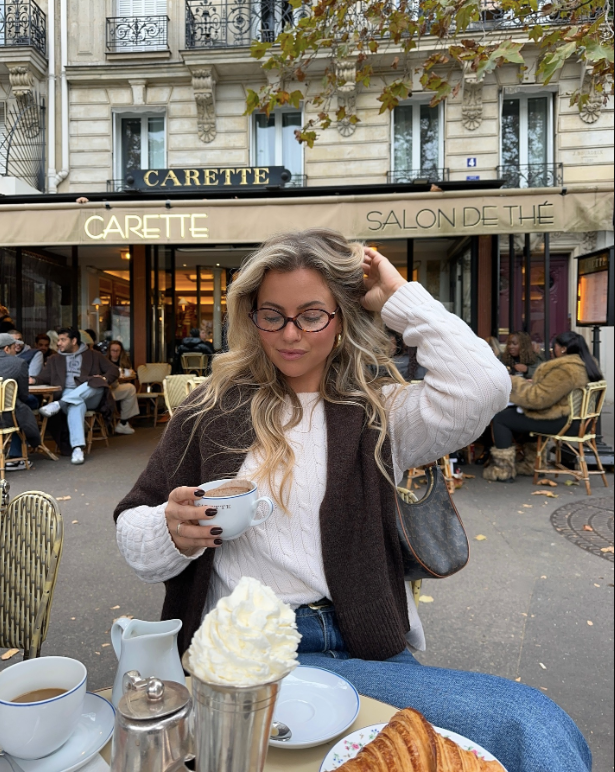 white sweater and brown vest
