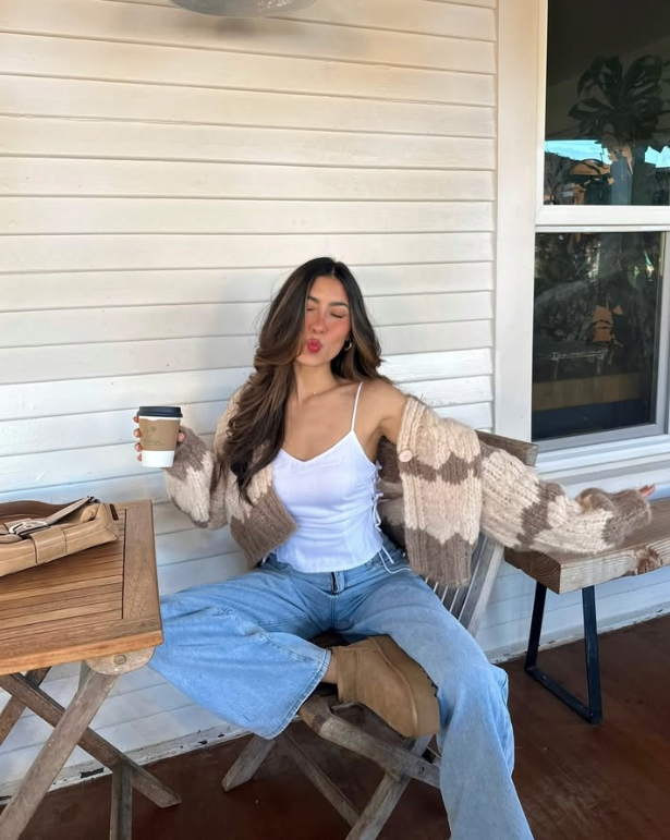 white tank top a cozy brown cardigan and light blue jeans