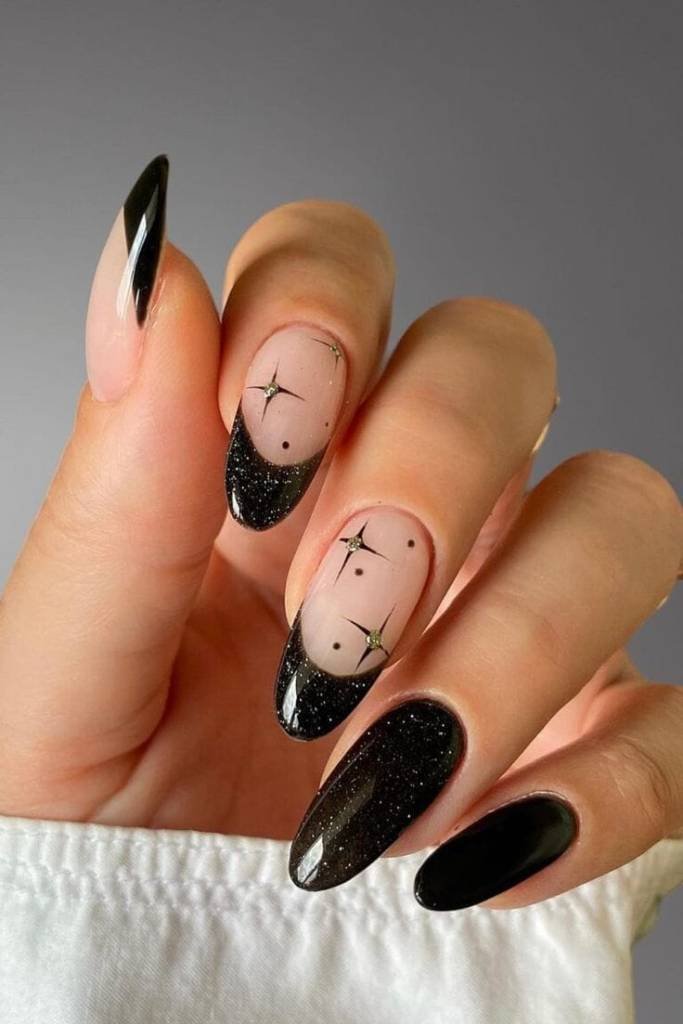 Black Nude Almond Nails with Star Accents