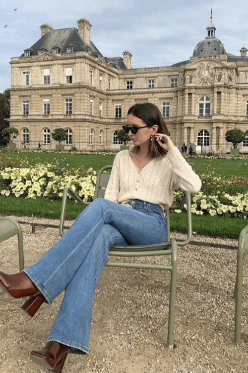 Cream Sweater With Blue Jeans and Brown Boots