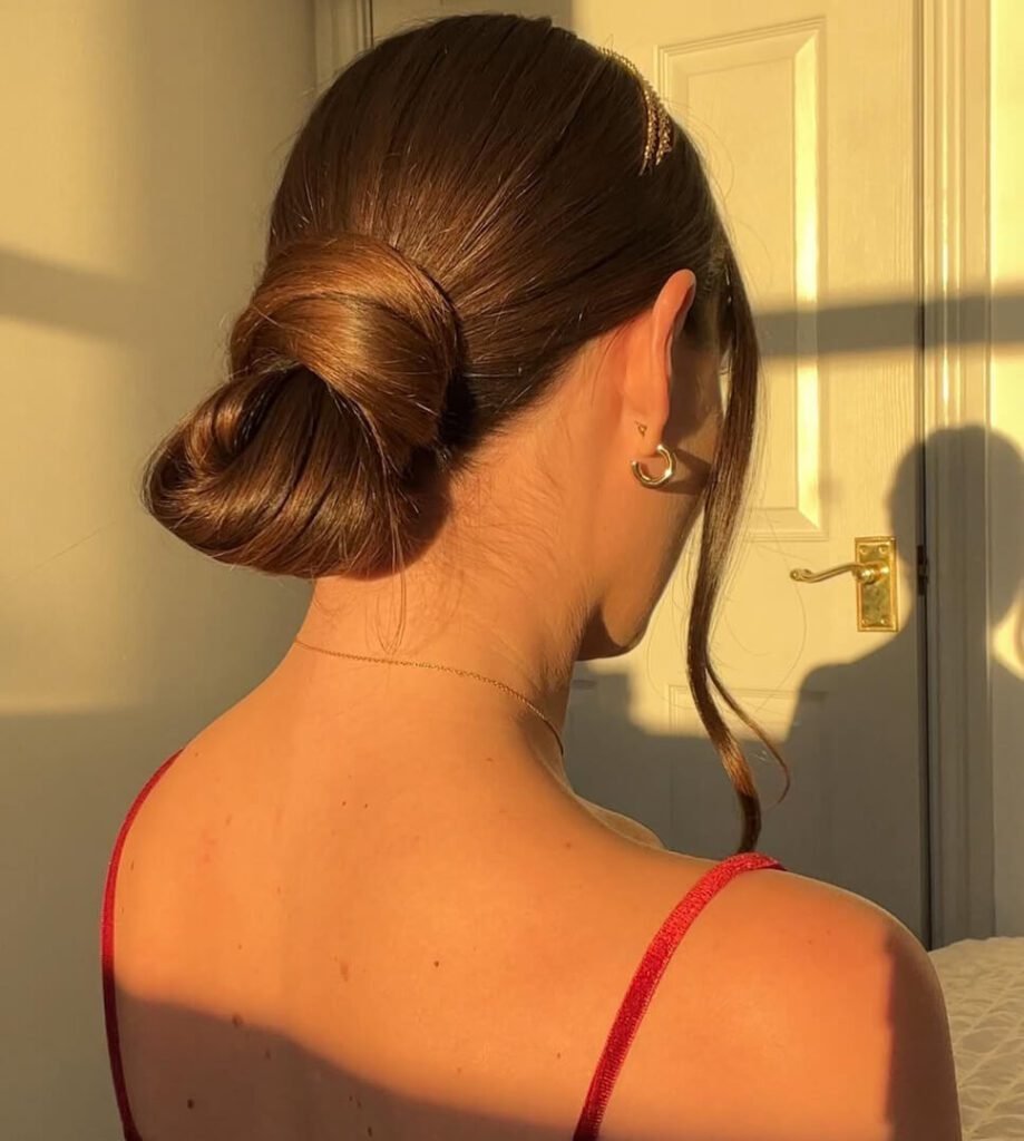 Low Bun with Side Strand