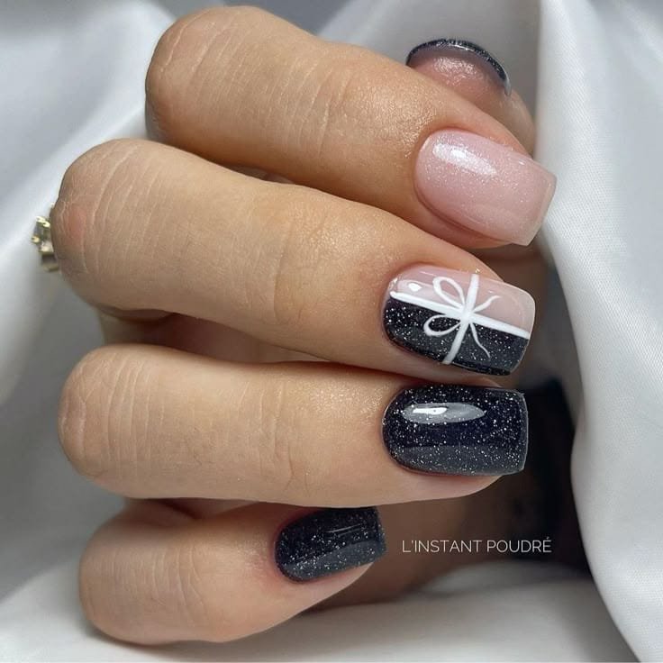 Sparkly Black Nails White Bow and Soft Pink Accent