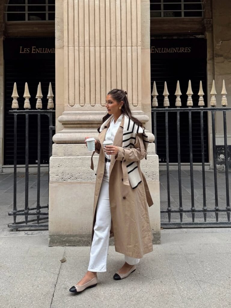 beige trench coat paired with crisp white pants