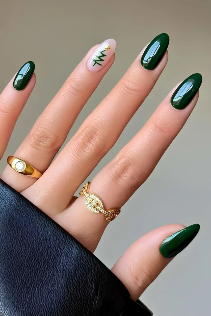 Dark green nails with Christmas tree art.jpg