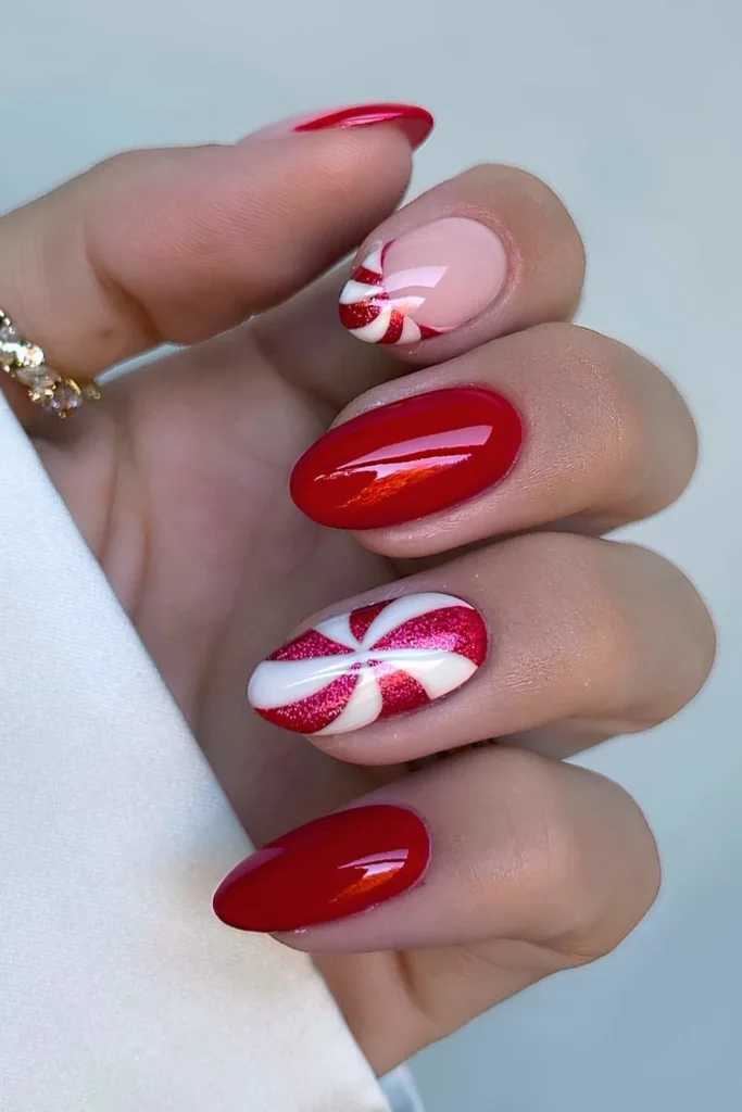 Red almond nails with peppermint swirl art.jpg
